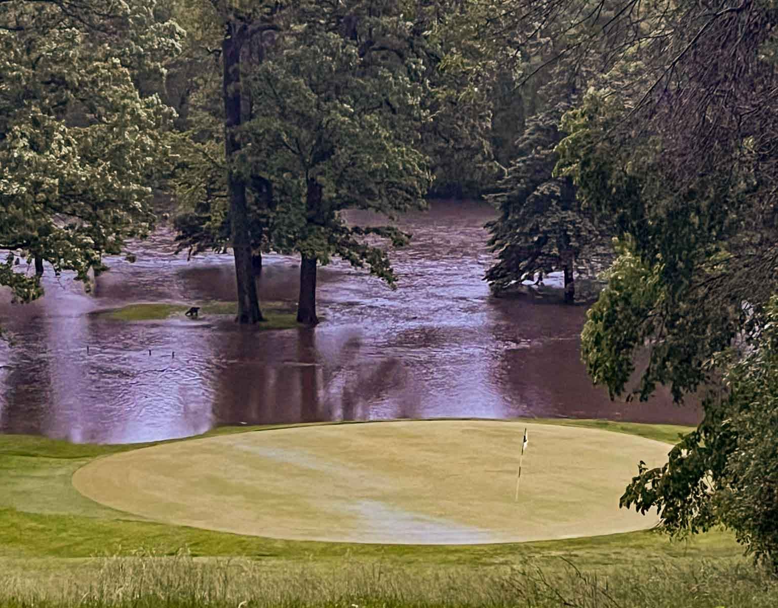 Floodwater over a green at Kenyon Country Club, June 2024